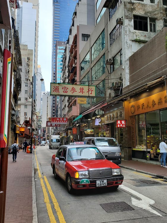 Taxicab in Hong Kong City Street. Photo by Mike Hongkong via Pexels.