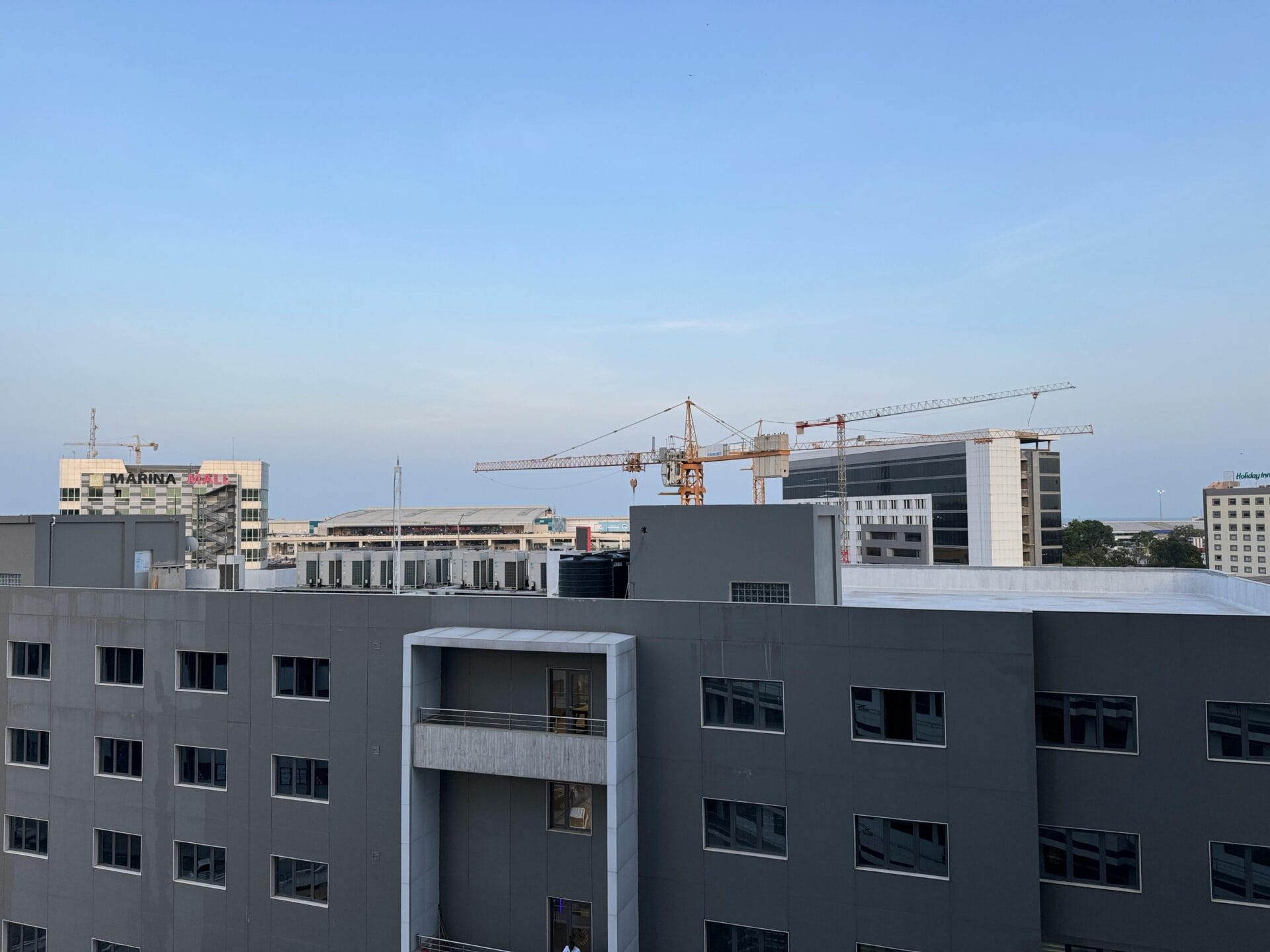 Modern Cityscape of Accra with Construction Cranes. Greater Accra, Ghana.